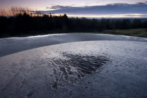 Marks from a shell burst scar the top of the 155mm gun cupola atop Fort Douaumont Marks from a shell burst scar the top of the 155mm gun cupola atop Fort Douaumont